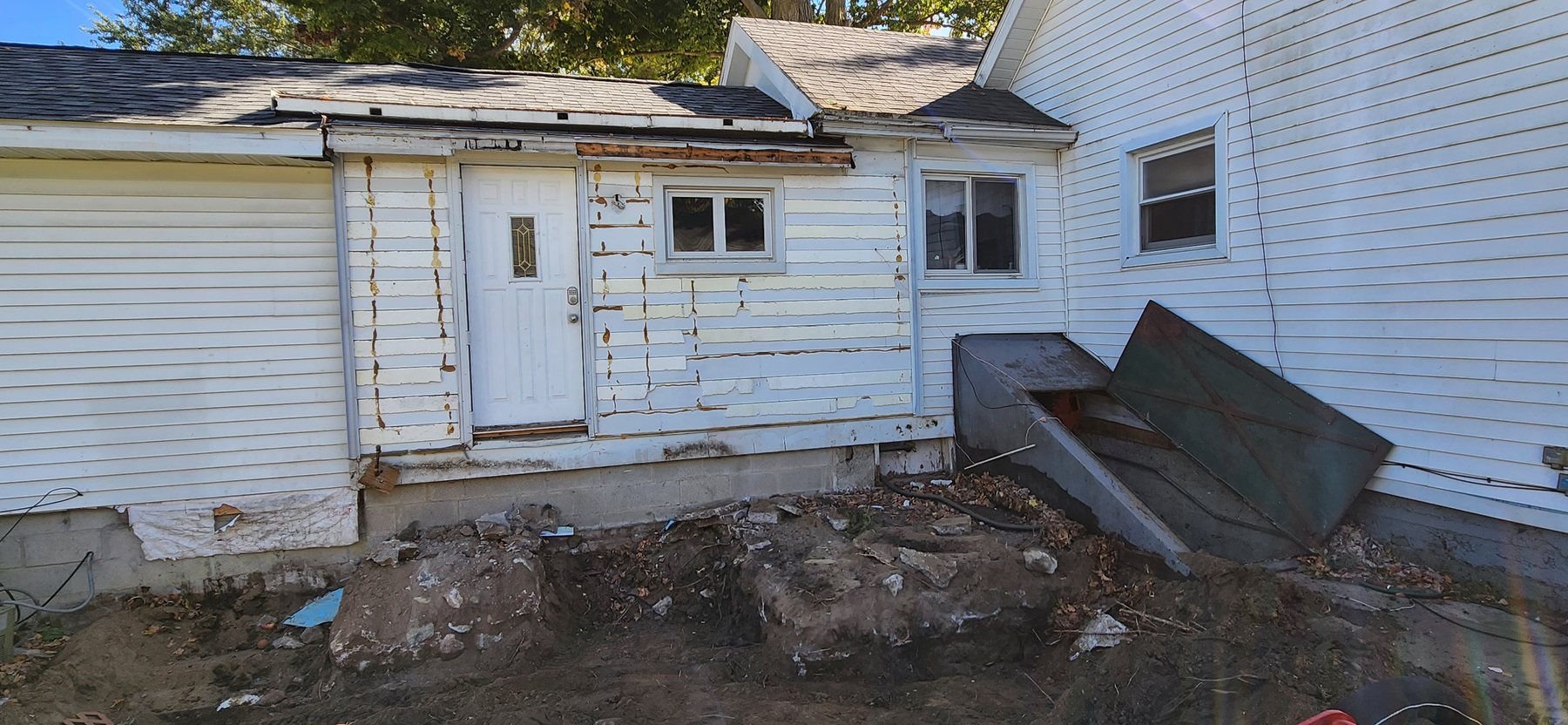 Excavated addition area after removal of old construction
