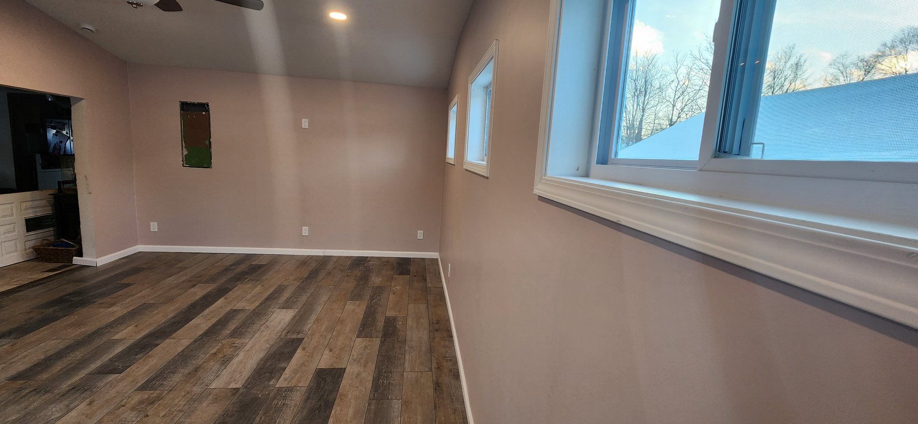 Finished interior of the Irwin addition showing new windows, flooring and vaulted ceiling